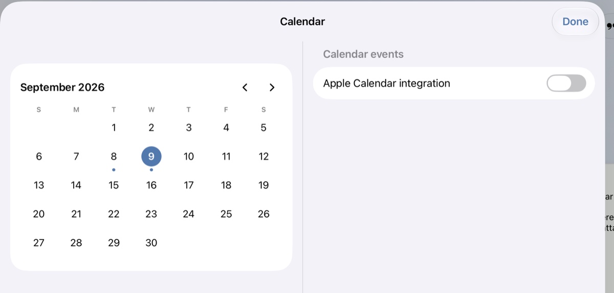 The iPad calendar sheet, with dots under the days that hold entries.